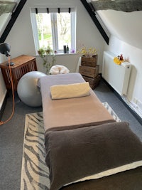 a room with a bed and pillows in it